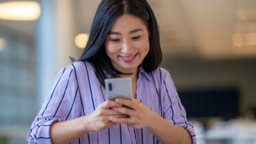 Woman sets up new Galaxy smartphone