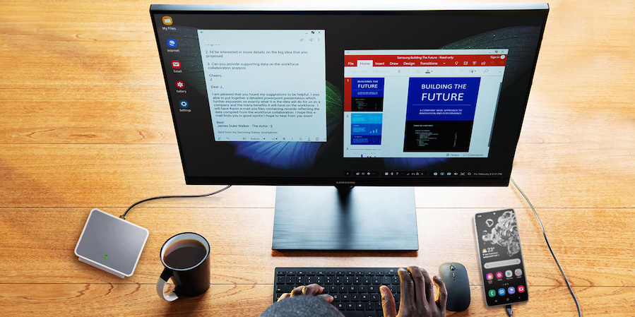 Professional working from home on a Galaxy S20 connected to Samsung DeX