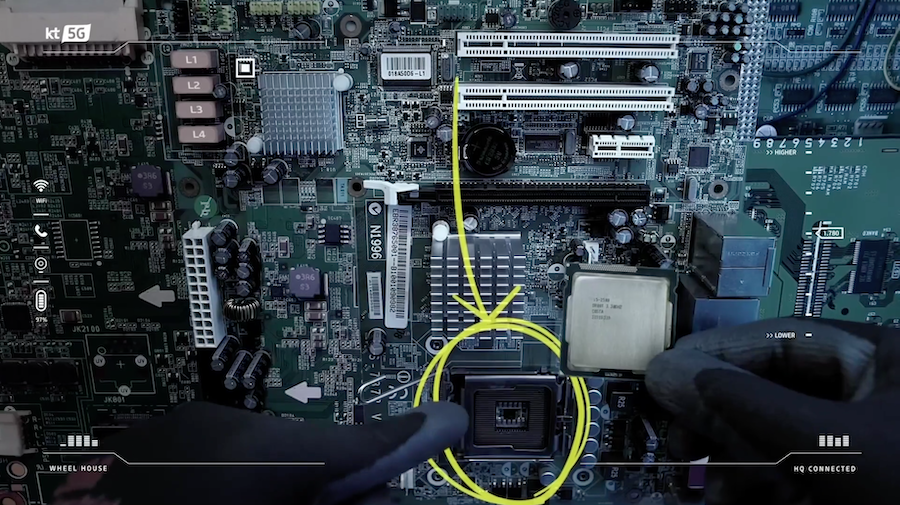 Factory worker installs chip into motherboard while being remotely directed using 5G connectivity