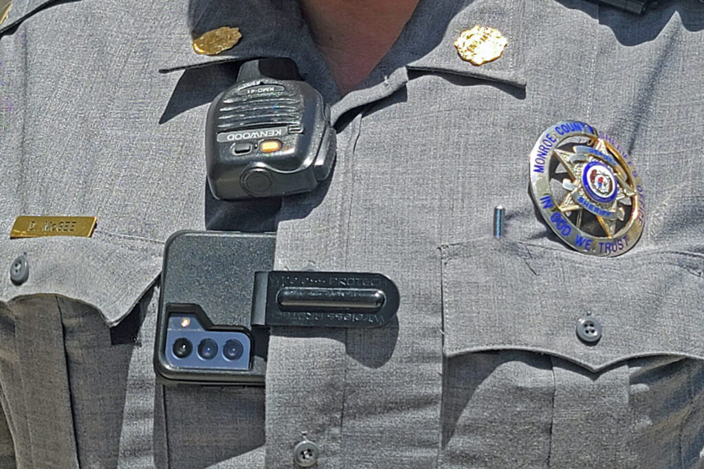 A close-up of a sheriff's body-worn camera.