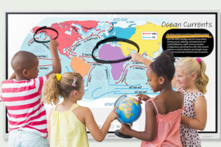 Teacher gives student feedback using interactive whiteboard in classroom